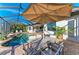 Enjoy alfresco dining on this covered patio next to the pool at 13823 Swiftwater Way, Bradenton, FL 34211