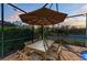 Outdoor dining area with patio furniture under an umbrella at 13823 Swiftwater Way, Bradenton, FL 34211