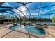 Stunning pool with spa and screened enclosure, overlooking a lake at 13823 Swiftwater Way, Bradenton, FL 34211