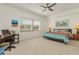 Bright bedroom with ceiling fan, carpet, and a large window at 14081 Black Beauty Dr # 1111, Punta Gorda, FL 33955