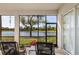 Screened lanai seating area with peaceful lake view at 14081 Black Beauty Dr # 1111, Punta Gorda, FL 33955