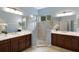 Elegant bathroom with double vanities, a large shower, and updated fixtures at 14333 Stirling Dr, Lakewood Ranch, FL 34202