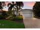 Attractive single-story home with landscaped yard and gray garage door at 14333 Stirling Dr, Lakewood Ranch, FL 34202