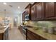 Modern kitchen featuring granite countertops, stainless steel appliances, and custom cabinetry at 14333 Stirling Dr, Lakewood Ranch, FL 34202