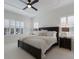 Main bedroom with plush bedding and plenty of natural light at 14614 Newtonmore Ln, Lakewood Ranch, FL 34202