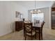 Formal dining room with a large table and seating for eight at 14614 Newtonmore Ln, Lakewood Ranch, FL 34202