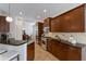 Spacious kitchen with stainless steel appliances and dark wood cabinets at 14614 Newtonmore Ln, Lakewood Ranch, FL 34202