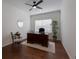 Home office with built-in desk and hardwood floors at 14614 Newtonmore Ln, Lakewood Ranch, FL 34202