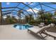 Screened pool and patio area with lounge chairs, offering a relaxing outdoor space at 14614 Newtonmore Ln, Lakewood Ranch, FL 34202