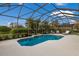 Screened-in pool and patio area with lounge chairs and outdoor seating at 14614 Newtonmore Ln, Lakewood Ranch, FL 34202