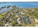 Aerial view of waterfront community with lush landscaping and private boat docks at 1519 Pelican Point Dr # 191, Sarasota, FL 34231