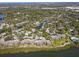 Aerial view of community, showcasing waterfront property, boat docks, and pool at 1519 Pelican Point Dr # 191, Sarasota, FL 34231