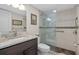 Modern bathroom with granite vanity and large shower at 1519 Pelican Point Dr # 191, Sarasota, FL 34231