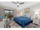 Spacious bedroom with king-size bed and private balcony access at 1519 Pelican Point Dr # 191, Sarasota, FL 34231