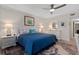 Main bedroom with king bed, ensuite bath, and access to patio at 1519 Pelican Point Dr # 191, Sarasota, FL 34231