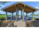 Relaxing waterfront gazebo with shaded seating at 1519 Pelican Point Dr # 191, Sarasota, FL 34231