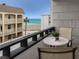 Ocean view balcony with table and chairs at 1555 Tarpon Center Dr # 261, Venice, FL 34285