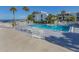 Refreshing community pool with lounge chairs, offering a relaxing resort-style experience at 1555 Tarpon Center Dr # 261, Venice, FL 34285