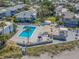 Relaxing pool area with patio, steps from the beach at 1555 Tarpon Center Dr # 261, Venice, FL 34285