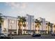 Modern multi-unit building with sleek design and palm trees at 162 Audubon Pl, Sarasota, FL 34237