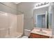 Bathroom with tub, toilet, and sink at 1910 Scarlett Ave, North Port, FL 34289