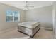 Bedroom with queen bed and ceiling fan at 1910 Scarlett Ave, North Port, FL 34289