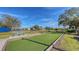 Community bocce ball court with green turf at 1910 Scarlett Ave, North Port, FL 34289