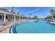 Resort-style pool with lounge chairs and clubhouse at 1910 Scarlett Ave, North Port, FL 34289