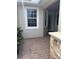 Inviting front porch with brick pavers and stone accents at 1910 Scarlett Ave, North Port, FL 34289