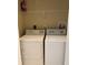 Laundry closet with washer and dryer included at 1910 Scarlett Ave, North Port, FL 34289