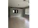 Spacious living room with tile flooring and neutral walls at 1910 Scarlett Ave, North Port, FL 34289