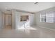 Living room with tile floors and view to kitchen at 1910 Scarlett Ave, North Port, FL 34289