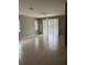 Bright living room with tile flooring and sliding glass doors at 1910 Scarlett Ave, North Port, FL 34289