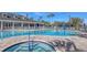 Relaxing community pool and spa with surrounding lounge chairs at 1910 Scarlett Ave, North Port, FL 34289