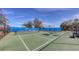 Tennis and pickleball courts with surrounding fence at 1910 Scarlett Ave, North Port, FL 34289