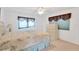 Bright bedroom with a double bed and dresser at 2107 Palma Sola Blvd # 13, Bradenton, FL 34209