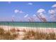 Scenic beach view with dunes and ocean at 2188 Fruitville Rd, Sarasota, FL 34237