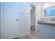 Bright bathroom with white cabinets and a spacious vanity at 2291 Pueblo Ln # V46, Sarasota, FL 34231