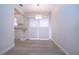 Bright dining area with light wood floors and sliding shutters at 2291 Pueblo Ln # V46, Sarasota, FL 34231