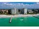 Aerial view of beachfront twin towers with pool and beach access at 2301 Gulf Of Mexico Dr # 52N, Longboat Key, FL 34228