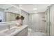 Spa-like bathroom with a modern vanity and herringbone tile floor at 2301 Gulf Of Mexico Dr # 52N, Longboat Key, FL 34228