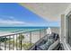 Stunning balcony view of ocean, beach, and palm trees at 2301 Gulf Of Mexico Dr # 52N, Longboat Key, FL 34228