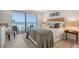 Cozy bedroom with ocean view and wicker headboard at 2301 Gulf Of Mexico Dr # 52N, Longboat Key, FL 34228