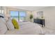 Main bedroom with ocean views and sliding glass doors to balcony at 2301 Gulf Of Mexico Dr # 52N, Longboat Key, FL 34228