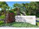 Islander Club entrance, 2301 and 2295 building address visible at 2301 Gulf Of Mexico Dr # 52N, Longboat Key, FL 34228