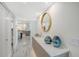 Bright entryway with marble floors and modern console at 2301 Gulf Of Mexico Dr # 52N, Longboat Key, FL 34228