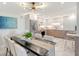 Modern kitchen featuring stainless steel appliances and marble floors at 2301 Gulf Of Mexico Dr # 52N, Longboat Key, FL 34228