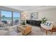 Bright living room with ocean views and comfy furniture at 2301 Gulf Of Mexico Dr # 52N, Longboat Key, FL 34228