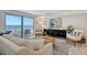 Bright living room with ocean views and comfy furniture at 2301 Gulf Of Mexico Dr # 52N, Longboat Key, FL 34228