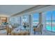 Living room with floor-to-ceiling windows and ocean view at 2301 Gulf Of Mexico Dr # 52N, Longboat Key, FL 34228